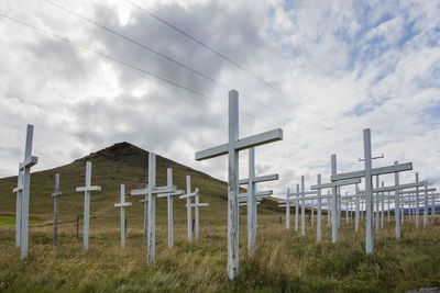 Built structure on field against sky