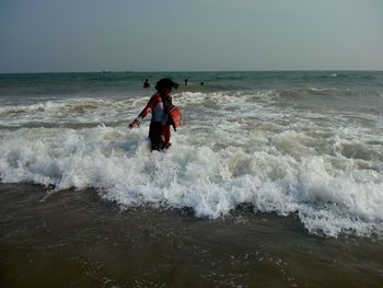 An indian women in sea shore