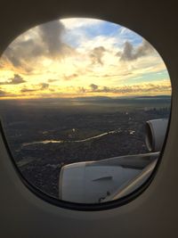 Aerial view of clouds over sea seen from airplane window