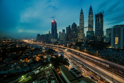 High angle view of illuminated cityscape at night