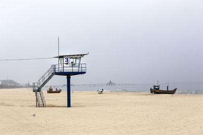 View of text on beach against sky