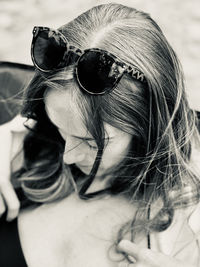 Close-up of young woman wearing sunglasses