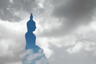 Low angle view of statue against sky