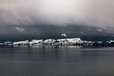 Scenic view of frozen sea against sky during winter