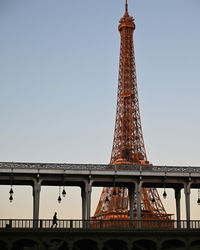 Low angle view of eiffel tower against clear sky