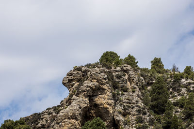 Low angle view of rock formation against sky