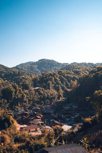 Scenic view of mountains against clear blue sky