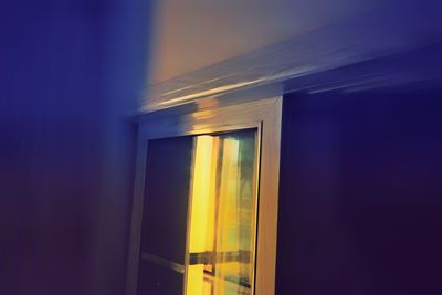 Illuminated building against sky at night