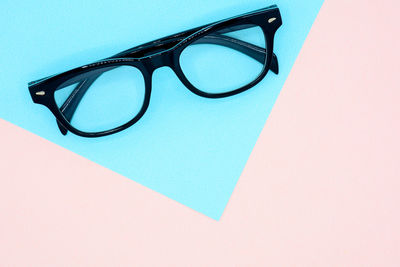 Close-up of eyeglasses against white background