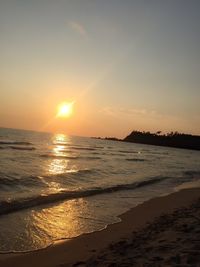 Scenic view of sea at sunset