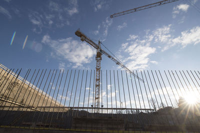 Construction crane in building industry, heavy machine at construction site