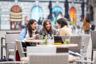 Friends having food at restaurant