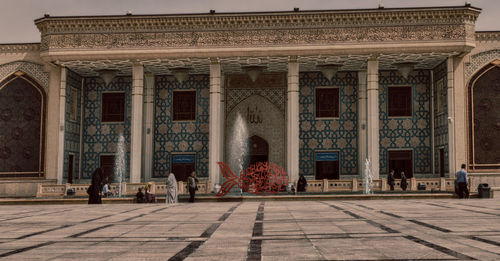 Group of people in front of historical building