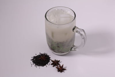 Close-up of drink against white background