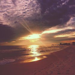 Scenic view of sea against cloudy sky