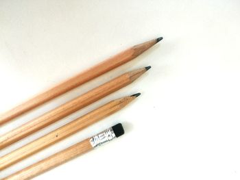 High angle view of pencils against white background