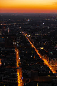 High angle view of illuminated buildings in city at night