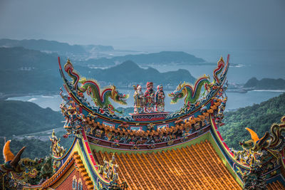 View of the roof of chinese temple at jiufen old street village on the hill in taiwan.