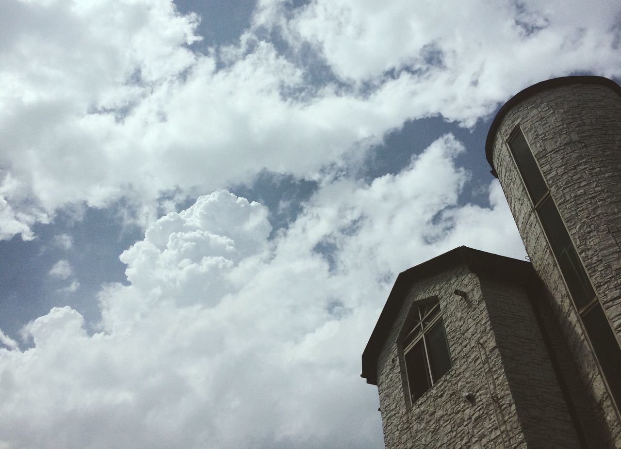 building exterior, architecture, built structure, low angle view, sky, cloud - sky, cloudy, cloud, tower, tall - high, building, city, modern, day, weather, outdoors, skyscraper, no people, office building, high section