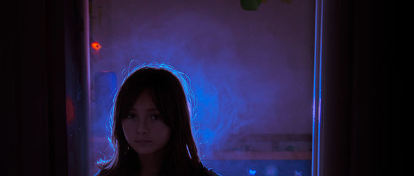 Portrait of girl in darkroom