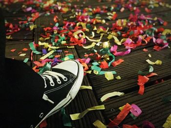 Close-up of multi colored objects on tiled floor