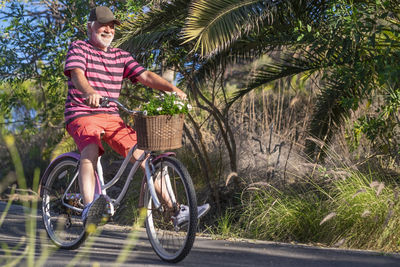 Man riding bicycle on road