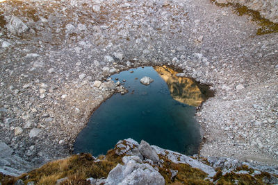 High angle view of rocks in sea