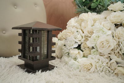 Close-up of white rose on table