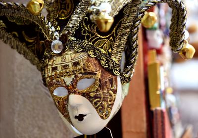 Close-up of ornate decoration hanging on metal