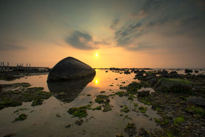 Scenic view of sea against sky during sunset