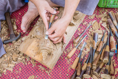 High angle view of man working on wood