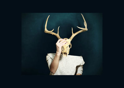 Close-up of man against black background