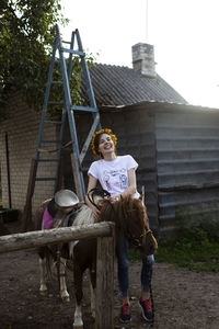 Portrait of woman sitting outdoors