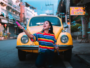 Portrait of woman on street in city