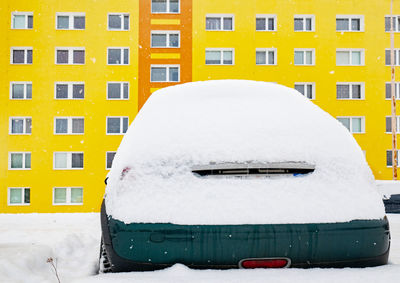 Car lost in snow in winter. cars were covered with snow. concept weather in city