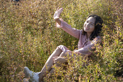 Woman lying on field