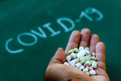 Close-up of hand holding text