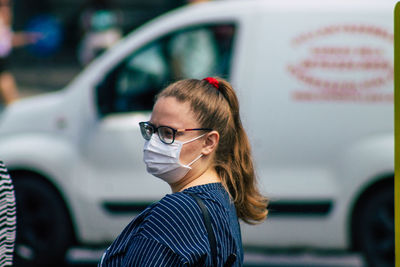 Portrait of young woman in car