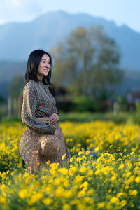 Woman standing on field