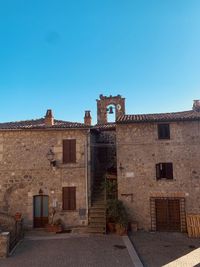 Old building against clear blue sky