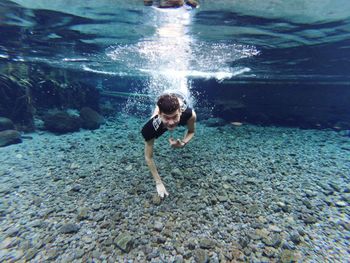 Portrait of man swimming undersea