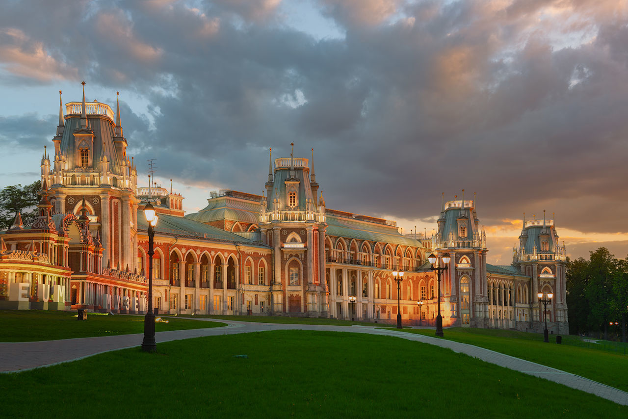 cloud - sky, sky, architecture, built structure, building exterior, grass, nature, travel destinations, plant, history, the past, travel, lawn, tourism, building, no people, outdoors, city, sunset