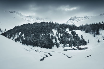 Scenic view of snow covered mountain against sky