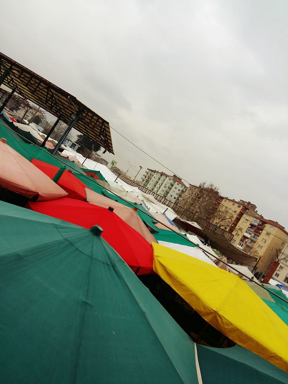 multi colored, built structure, sky, architecture, flag, low angle view, no people, building exterior, outdoors, day, nature