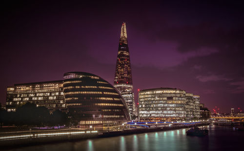 Illuminated buildings in city at night