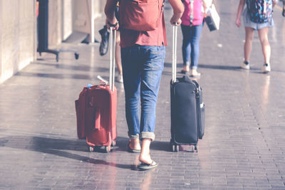 Rear view of people walking in airport