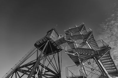 Low angle view of ferris wheel against sky