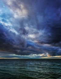 Scenic view of sea against cloudy sky