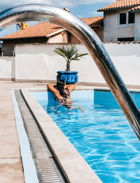 Young woman in bikini in swimming pool. summer, lifestyle.