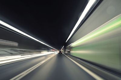 Blurred motion of illuminated tunnel